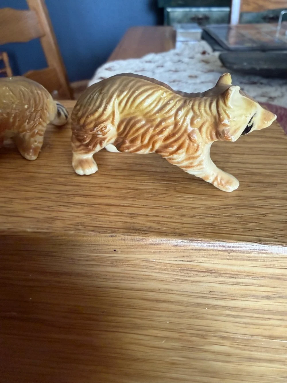 Mini pair of raccoon figurines